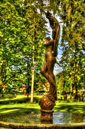 This photo present nymph on a fountain in the park HDR の写真素材