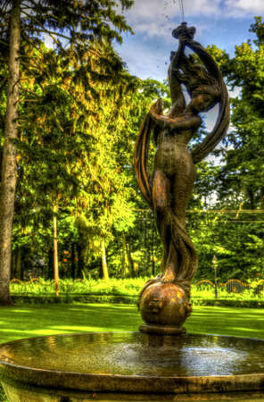 This photo present nymph on a fountain in the park HDR の写真素材