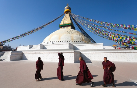 Nepal, Kathmandu -17th of December 2013  Tibetan Buddhist monks walking around Boudhanath stupa during festival のeditorial素材