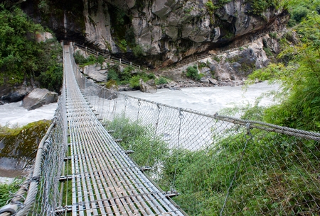 rope hanging suspension bridge - Everest base camp trek in Nepalの写真素材