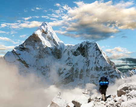 Beautiful view of Ama Dablam with tourist and beautiful clouds - Sagarmatha national park - Khumbu valley - Trek to Everest base camp - Nepalの写真素材