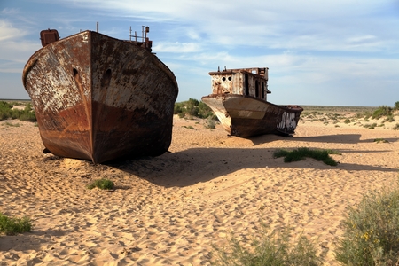 Boats in desert around Moynaq, Muynak or Moynoq - Aral sea or Aral lake - Uzbekistan - asiaの写真素材