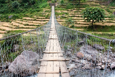 rope hanging suspension bridge in Nepalの写真素材