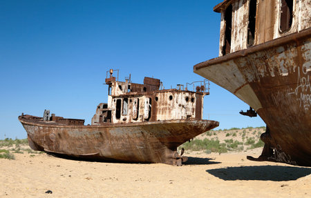 Boats in desert around Moynaq, Muynak or Moynoq - Aral sea or Aral lake - Uzbekistan - asia