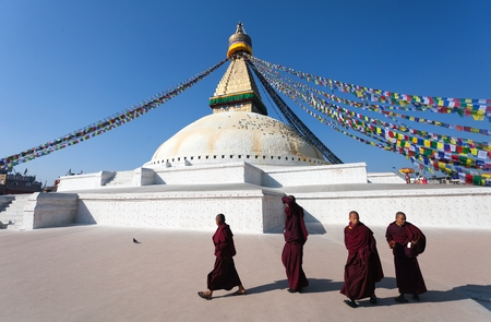 Nepal, Kathmandu -17th of December 2013: Tibetan Buddhist monks walking around Boudhanath stupa during festivalのeditorial素材