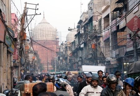 INDIA, OLD DELHI, 5th of December 2010 - Overcrowded street in old town with smog, dangerous electric lines and Jama masjidのeditorial素材