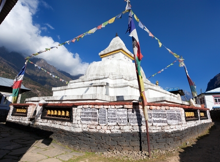 Stupa with prayer flags on the way from Lukla to Namche bazar in chaurikharka near chheplung village - nepalの写真素材