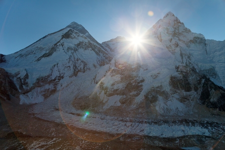 Morning sun above Mount Everest, lhotse and Nuptse from Pumo Ri base camp - Way to Everest base camp - Nepalの写真素材
