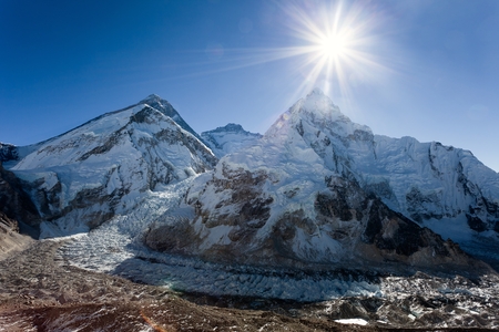 Morning sun above Mount Everest, lhotse and Nuptse from Pumo Ri base camp - Way to Everest base camp - Nepalの写真素材
