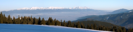 Panoramic wintry view of High Tartas mountains from Fatra mountainsの写真素材