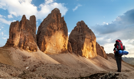 Evening view of Drei Zinnen or Tre Cime di Lavaredo, Sextener Dolomiten or Dolomiti di Sesto with hiker, South Tirol, Dolomiten mountains view, Italien Alpsの写真素材