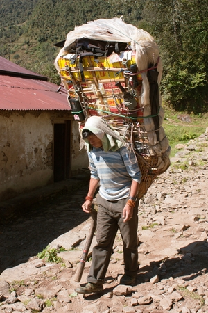 KHUMBU VALLEY, NEPAL, 26th OCTOBER 2010 - Sherpa porters with goods way to Everest base camp, Khumbu valley, Sagarmatha national park, Nepalのeditorial素材