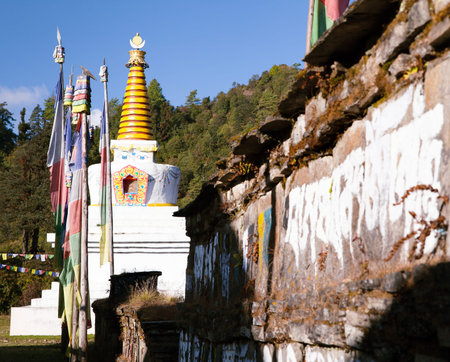 Buddhist stupa, prayer flags and Mani prayer wall, Khumbu valley, Solukhumbu, Sagarmatha national park, Nepalのeditorial素材