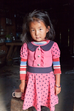 WAKU, NEPAL, 3RD NOVEMBER 2014 - Nepalese little girl in typical Nepalese kitchen in Khumbu valleyのeditorial素材
