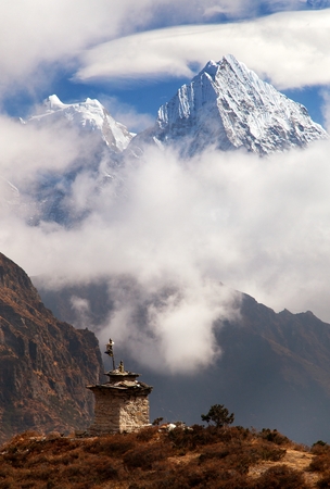 mounts Kangtega and Thamserku near Namche Bazar with stupas and beautiful clouds, Khumbu valley, Solukhumbu, Sagarmatha national park, Nepalの写真素材