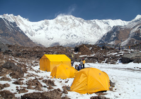 ANNAPURNA BASE CAMP, NEPAL,12th APRIL 2016 - View of Mount Annapurna with tents and people from base camp, Nepalのeditorial素材