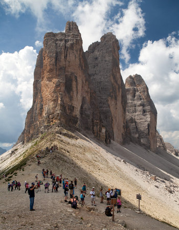 TRE CIME, ITALY, 17th JULY 2015 - Tourists under Drei Zinnen or Tre Cime di Lavaredo with beautiful sky, Sextener Dolomiten or Dolomiti di Sesto, South Tirol, Dolomiten mountains, Italien Alpsのeditorial素材