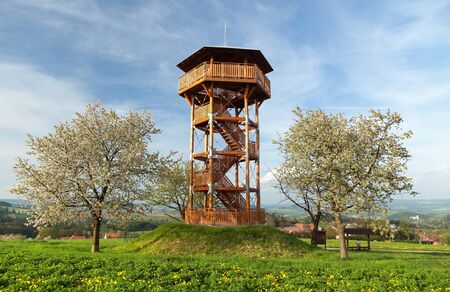 Springtime view, looking tower and flowering cherry treesの写真素材