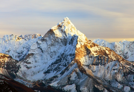 Evening panoramic sunset view of Ama Dablam with beautiful clouds on the way to Everest Base Camp, Khumbu valley, Solukhumbu, Nepal Himalayas mountainsの写真素材