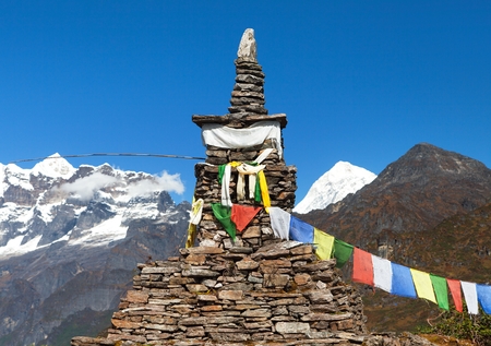 Mount Makalu with stone stupa and buddhist prayer flags, Maklu barun national park, Nepal Himalayasの写真素材
