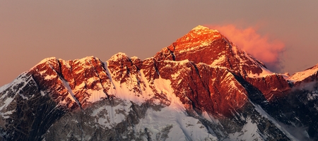 Evening sunset red colored view of mount Everest Lhotse and Nuptse south rock face with beautiful clouds from Kongde village, Khumbu valley, Solukhumbu, Nepal Himalayas mountainsの写真素材