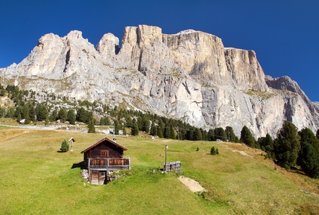 small cottage under Sella gruppe or Gruppo di Sella, South Tirol, Alps Dolomites mountains, Italyのeditorial素材