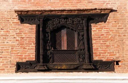 Carved wooden window and doorway details on the Royal Palace. Durbar square, Patan, Kathmandu, Nepalのeditorial素材