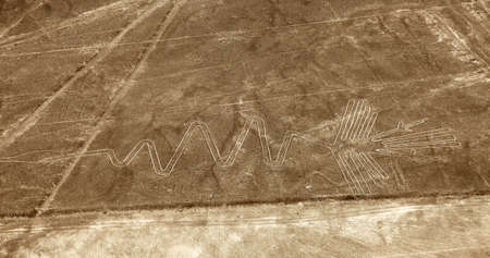 flamingo geoglyph, Nazca mysterious lines and geoglyphs aerial view sepia colored, landmark in Peruの写真素材