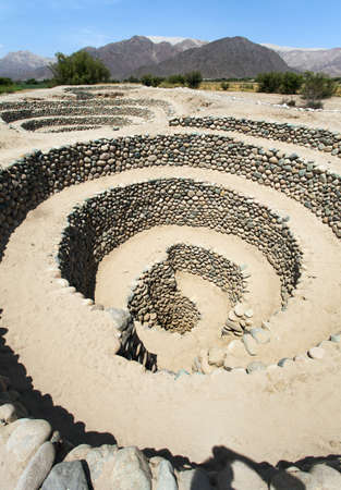 Cantalloc Aqueduct in Nazca or Nazca town, spiral or circle aqueducts or wells, Peru, Inca architecture and cultureの写真素材