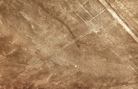 Hummingbird geoglyph sepia colored, Nazca or Nasca mysterious lines and geoglyphs aerial view,...