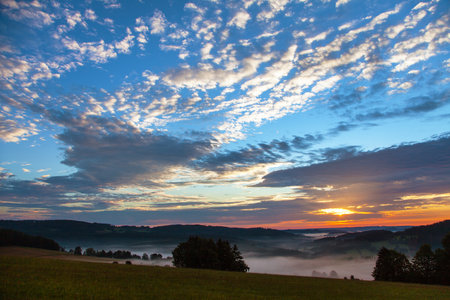 Morning evening panoramic sunset view of beautiful sky from Bohemian and Moravian highland near Krasne villageの写真素材