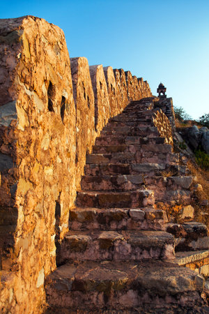 fortification with bastions of Jaigarh fort and Amer or Amber town near Jaipur city India evening...