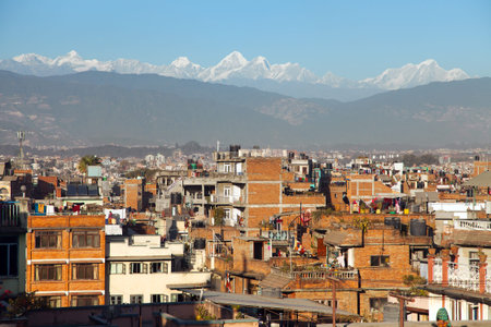 Evening panoramic view of Patan or Pathan town and Kathmandu city with Himalayas mountains, Nepal