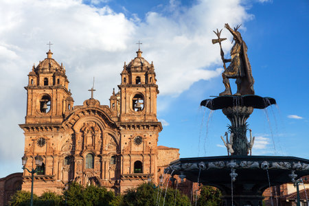 Statue of Inca Pachacutec on fountain and catholic church on Plaza de Armas, Cusco or Cuzco town, Peruの写真素材