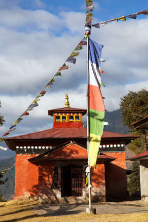 Bupsa buddhist gompa monastery with prayer flags near Lukla and Kharikhola village, Khumbu valley, Everest area, Solukhumbu, Buddhism in Nepal Himalayasの写真素材