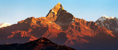 red colored sunset view of mount Machhapuchhare, Annapurna area, Nepal himalayasの写真素材