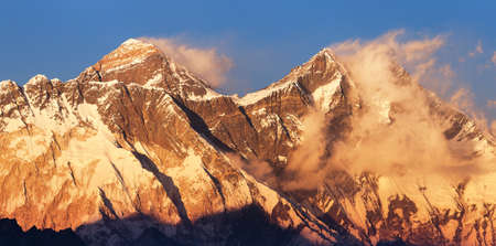 Mount Everest and Lhotse with beautiful clouds from Kongde village, evening sunset red colored view, Khumbu valley, Solukhumbu, Nepal Himalayas mountainsの写真素材