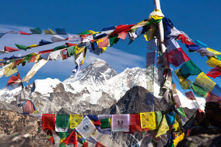 view of Mount Everest and Lhotse with buddhist prayer flags from Gokyo Ri peak, Khumbu valley,  Nepal Himalayas mountainsの写真素材