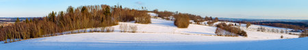 Evening winter landscape view from Bohemian and Moravian highland near Velke Mezirici town, Czech Republicの写真素材