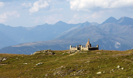 The Alps and the memorial to the victims of the First World War. Carnic Alps. Austria and Italy borderの写真素材