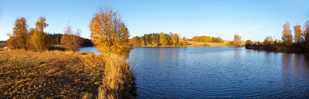 autumn view of pond with reflection of colorful autumn forest landscape, Divka pond, Hamry nad Sazavou, Bohemian and Moravian highlands, Czech Republicの写真素材