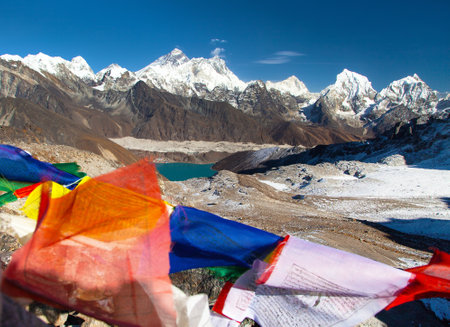 view of Mount Everest, Lhotse and Makalu with buddhist prayer flags, Mount Everest seen from Renjo La pass - Nepal himalaya mountain, Khumbu valleyの写真素材