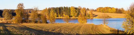 autumn view of pond with reflection of colorful autumn forest landscape, Divka pond, Hamry nad Sazavou, Bohemian and Moravian highlands, Czech Republicの写真素材