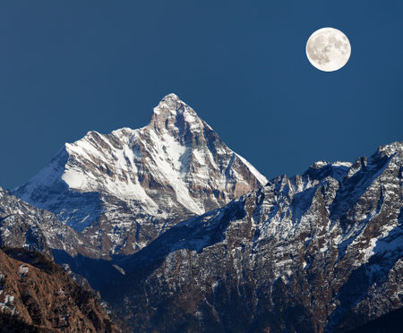 mount Nanda Devi, night view with moon, one of the best mounts in Indian Himalaya, seen from Joshimath Auli, Uttarakhand, Indiaの写真素材