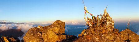 Mountain view of great Himalayan range, Himalayan mountains with Buddhist prayer flags, evening sunset panoramic viewの写真素材