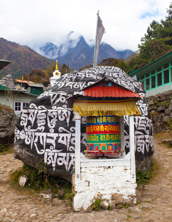 Prayer walls and prayer wheels in Khumbu valley, way to Everest base camp, Nepal Himalayas mountainsの写真素材
