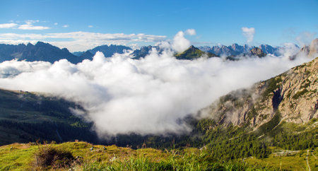 Dolomites mountains in the middle of Clouds, Carnian Alps mountains, Italyの写真素材
