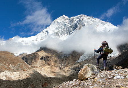 Mount Makalu with tourists and clouds, Nepal Himalayas, Barun valleyの写真素材