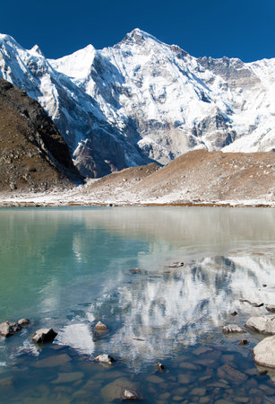 Mount Cho Oyu reflecting in lake, way to Cho Oyu base camp, Everest area, Sagarmatha national park,...