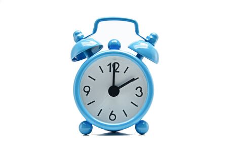 The blue alarm clock tells the time.の写真素材